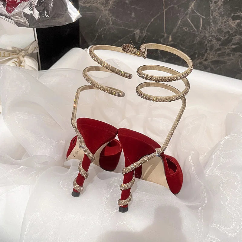 Snake shaped wrapped rhinestone suede pointed high heels